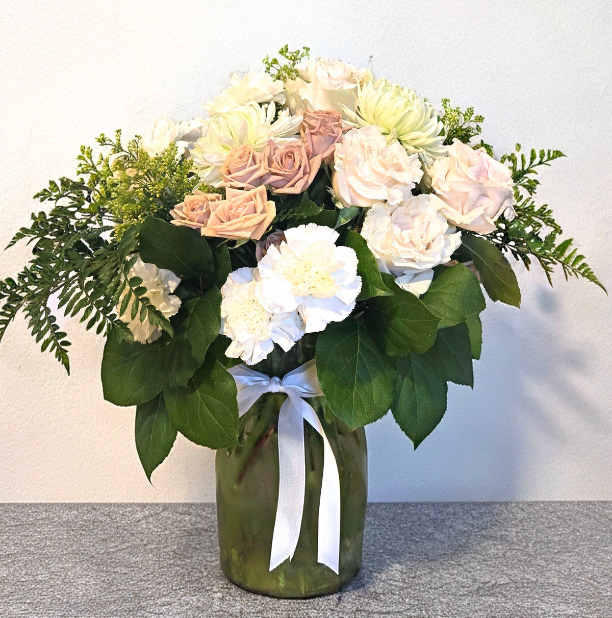 Chilliwack flowers vase arrangement bouquet. Soft and pretty pastel pink peach white cream roses lilies eucalyptus in large vase tied with big bow. Birthday Sympathy et well