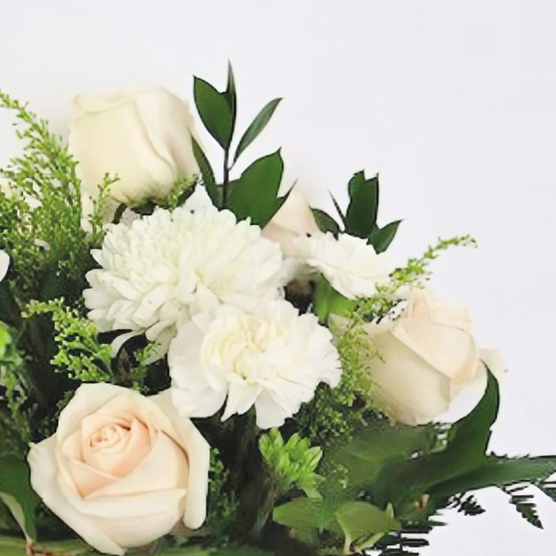 Green and White Flower Arrangement in a Vase