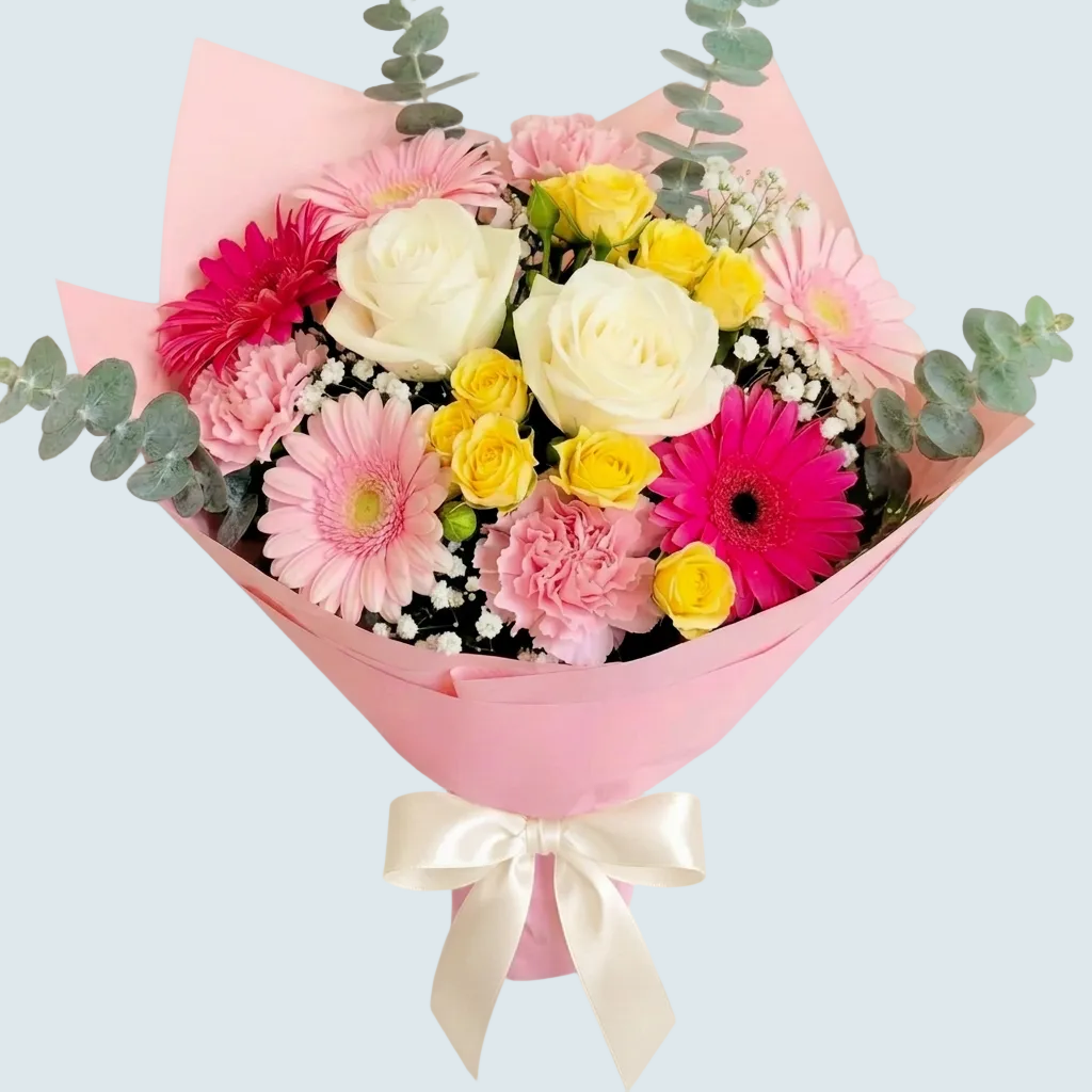 Bouquet of pink and white flowers with a pink wrap held by a person in a flower shop against a light background delivery in Chilliwack