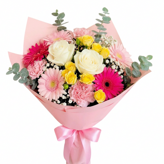 Bouquet of pink and white flowers with a pink wrap held by a person in a flower shop against a light background delivery in Chilliwack