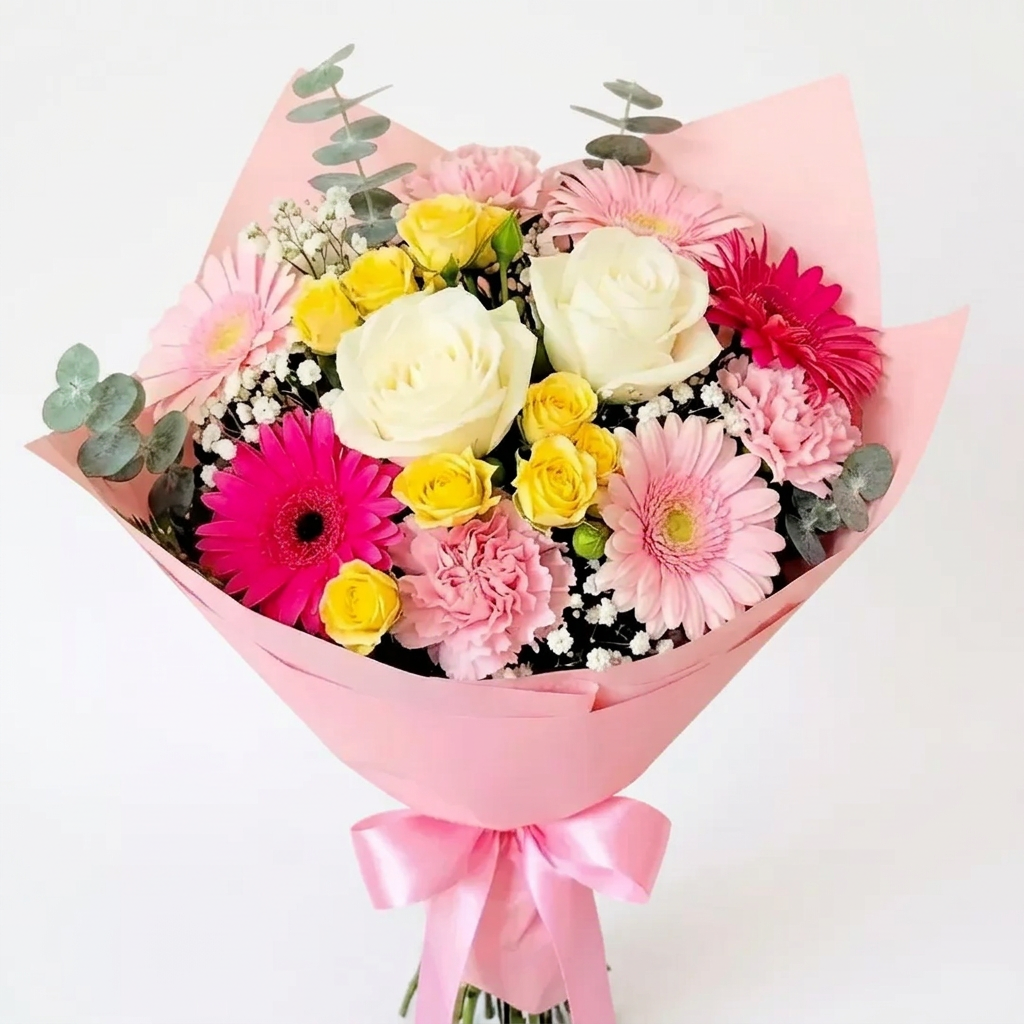 Bouquet of pink and white flowers with a pink wrap held by a person in a flower shop against a light background delivery in Chilliwack