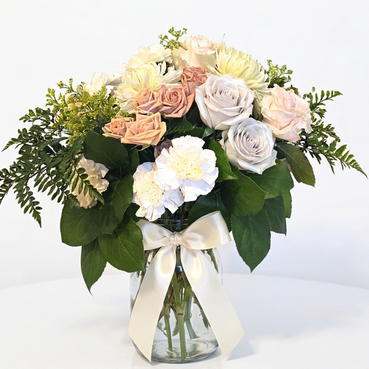 Chilliwack flowers vase arrangement bouquet. Soft and pretty pastel pink peach white cream roses lilies eucalyptus in large vase tied with big bow. Birthday Sympathy et well