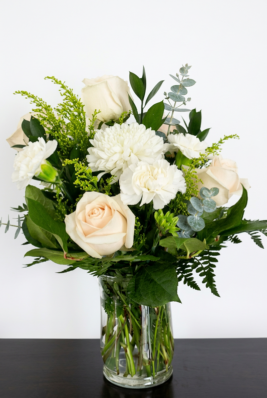 Green and White Flower Arrangement in a Vase